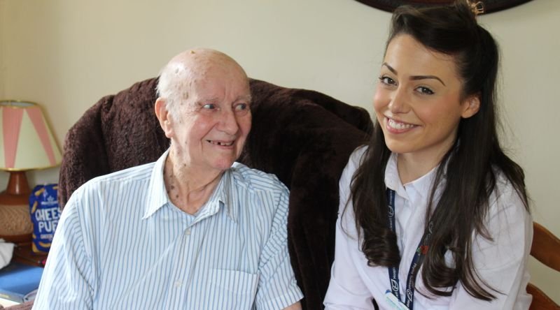 Patient and clinical nurse specialist smiling