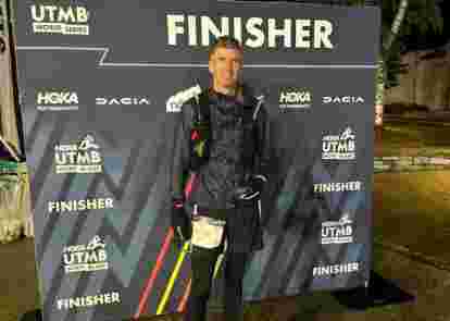 Ben at Finishers sign