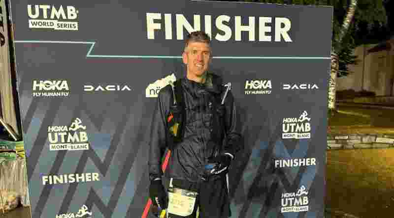 Ben at Finishers sign
