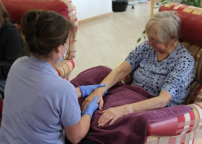 Carer receiving hand massage