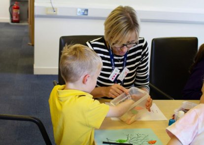 Volunteer with child