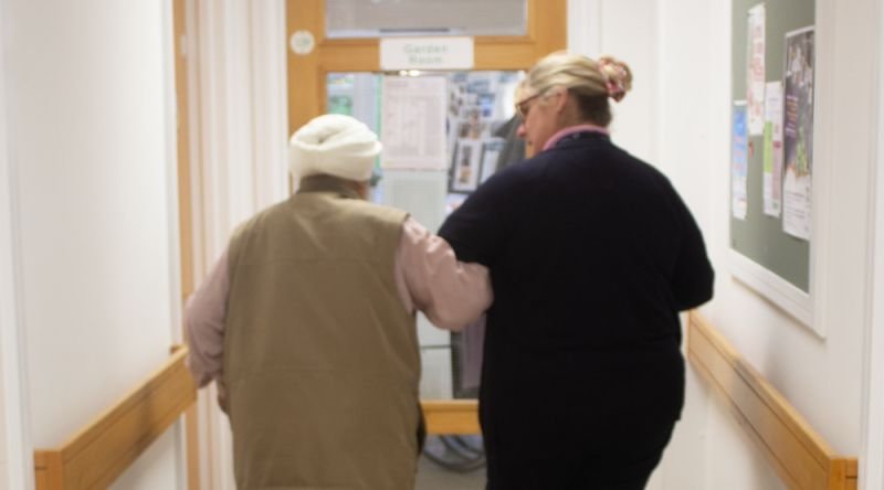 Patient with rehabilitation assistant