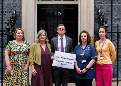 People standing in front of 10 Downing Street