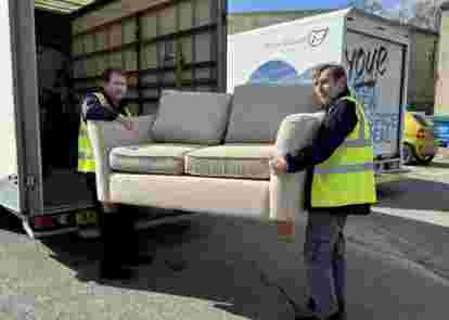 Men carrying sofa