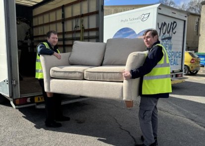 Men carrying sofa