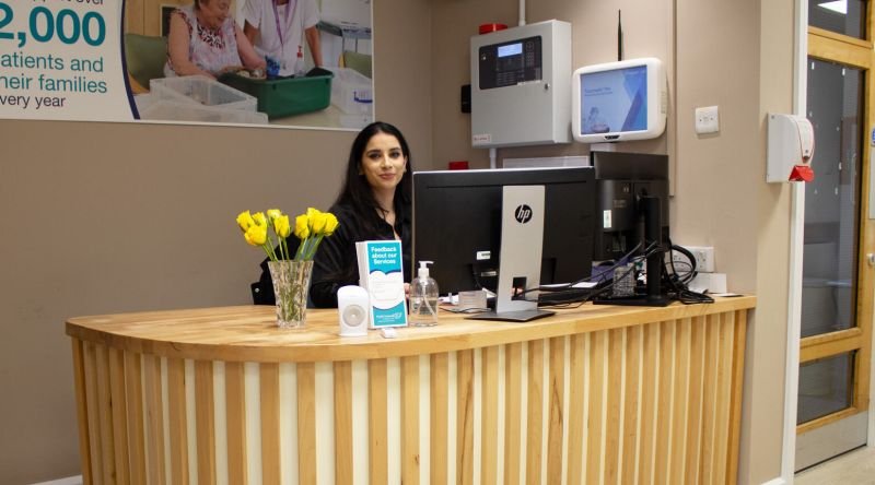 Lady sat at reception desk
