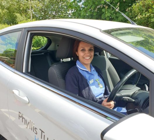Nurse in car