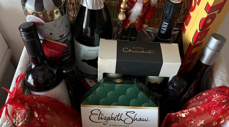 A hamper filled with wine and chocolates