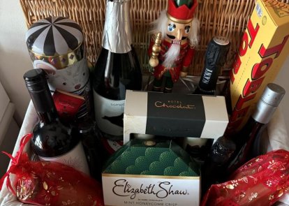 A hamper filled with wine and chocolates