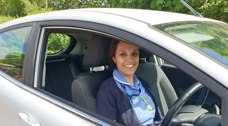 Nurse in car