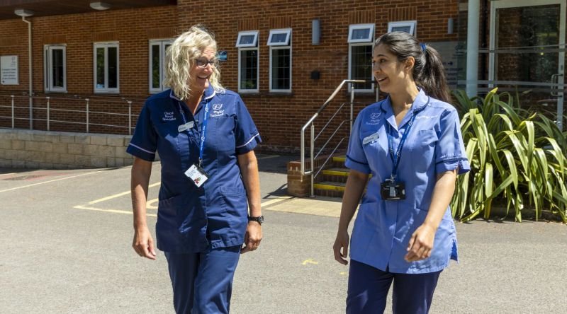 Nurses smiling and talking