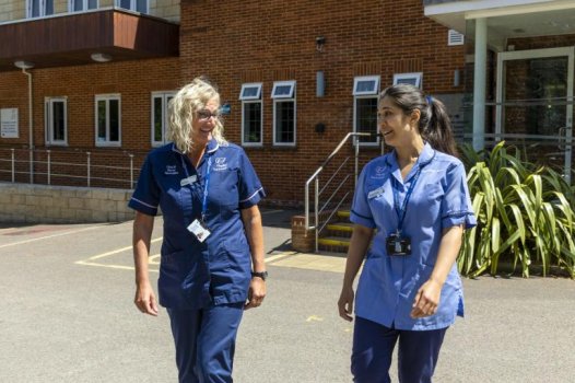 Nurses smiling and talking