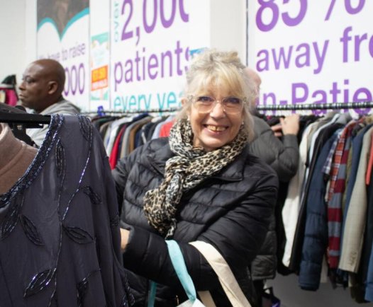 Smiling lady with shopping rails