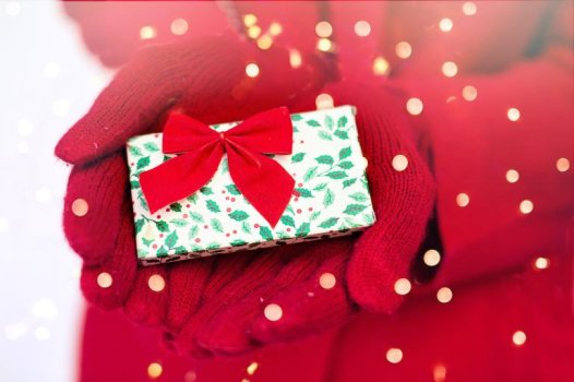 Hands holding a beautifully wrapped gift