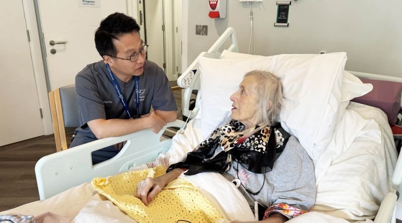 Patient with doctor on In-Patient Unit