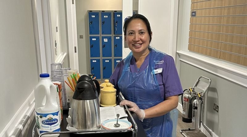 Housekeeper with tea trolley