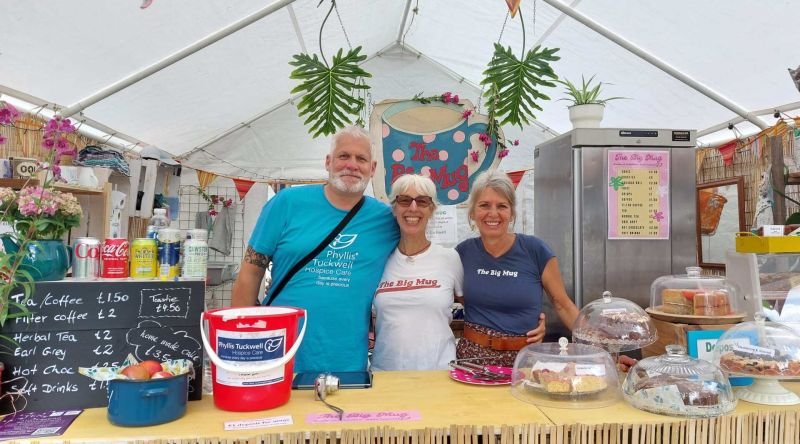 Group smiling at stall at Weyfest