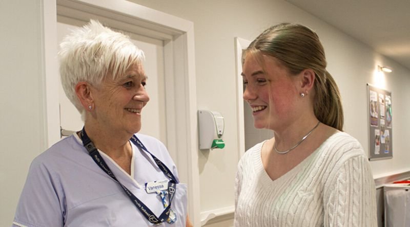 Nurse with student volunteer