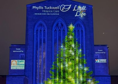 Guildford Cathedral with lights projected onto it