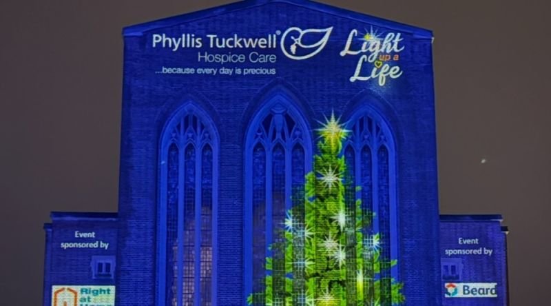 Guildford Cathedral with lights projected onto it
