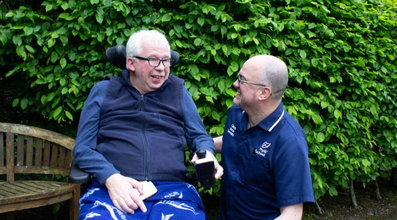 Patient and clinical nurse specialist smiling