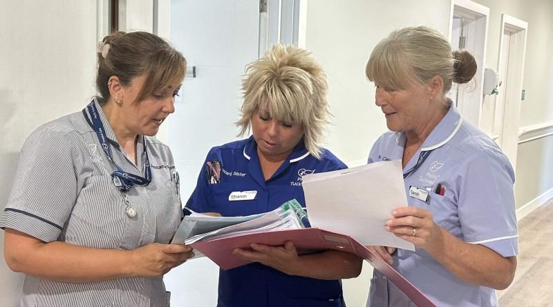 Nurses looking at paperwork