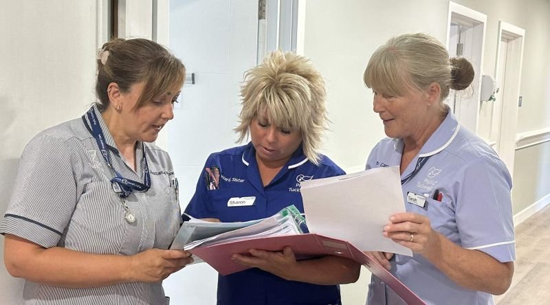 Nurses looking at paperwork