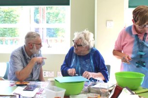 Patients cooking at a table