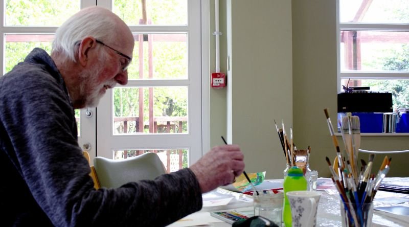 Peter painting at a Living Well session