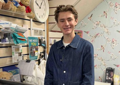 A volunteer in a shop