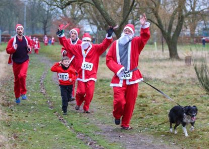 People running dressed as Santa