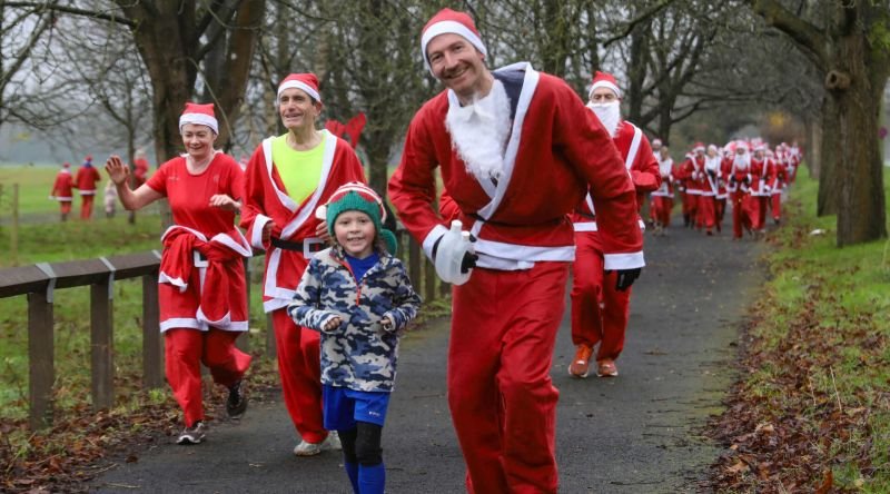 People running dressed as Santa