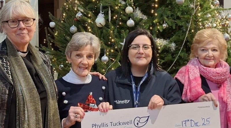 People holding a big cheque