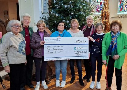 People presenting cheque