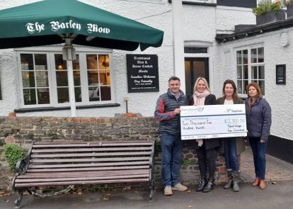 Tilford Fete Committee members with cheque