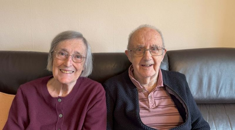 Two people sitting together