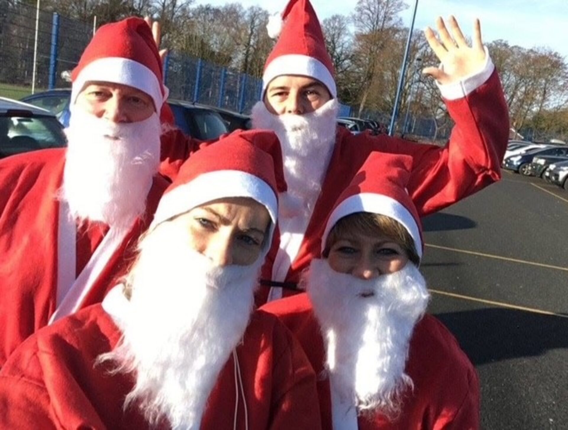 A family dressed as Santa
