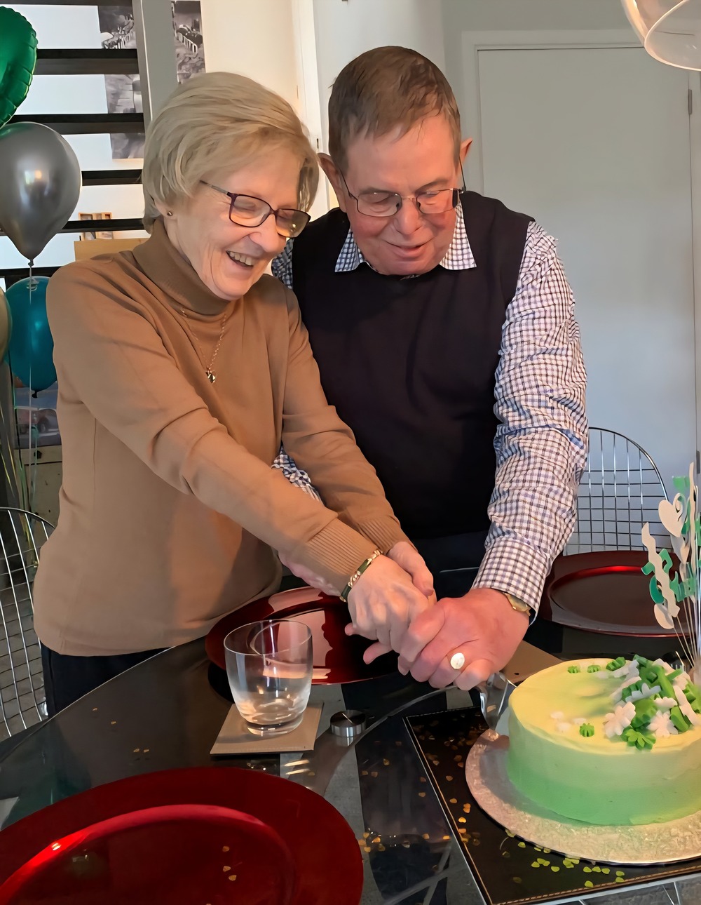 Ian and Ann cutting a cake