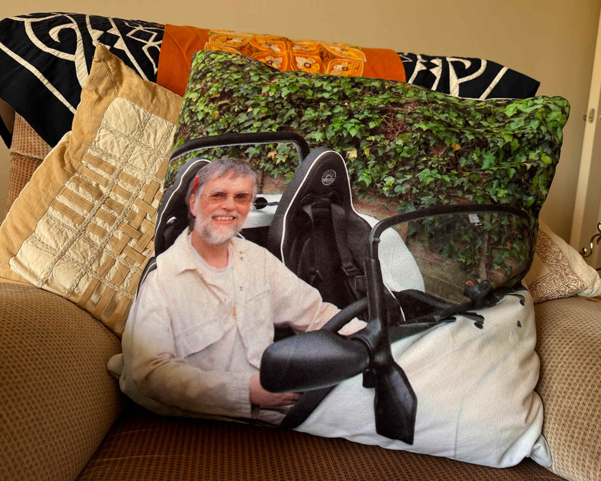 A photo of John printed onto a cushion