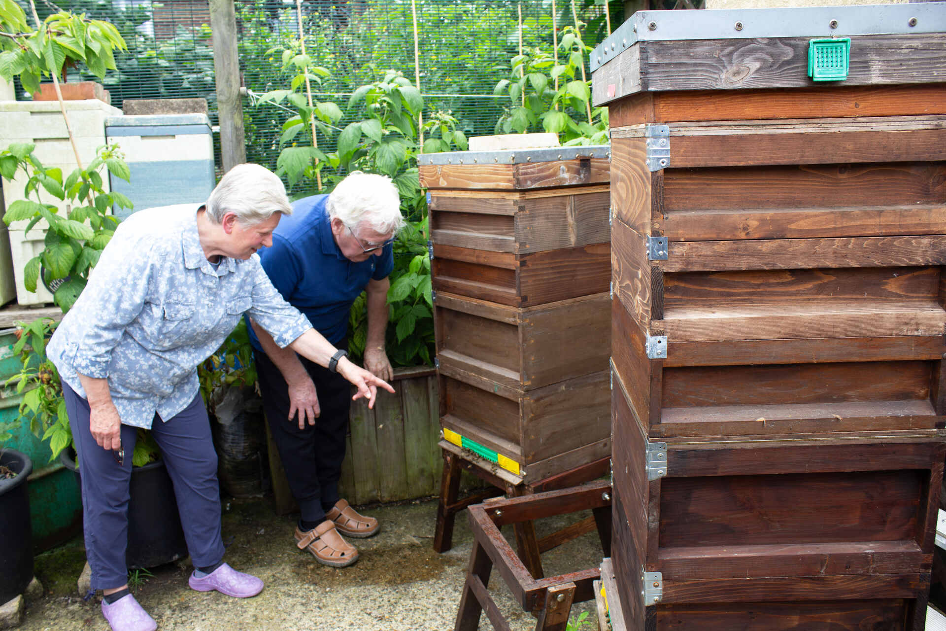 Lynn and Colin with their beehives