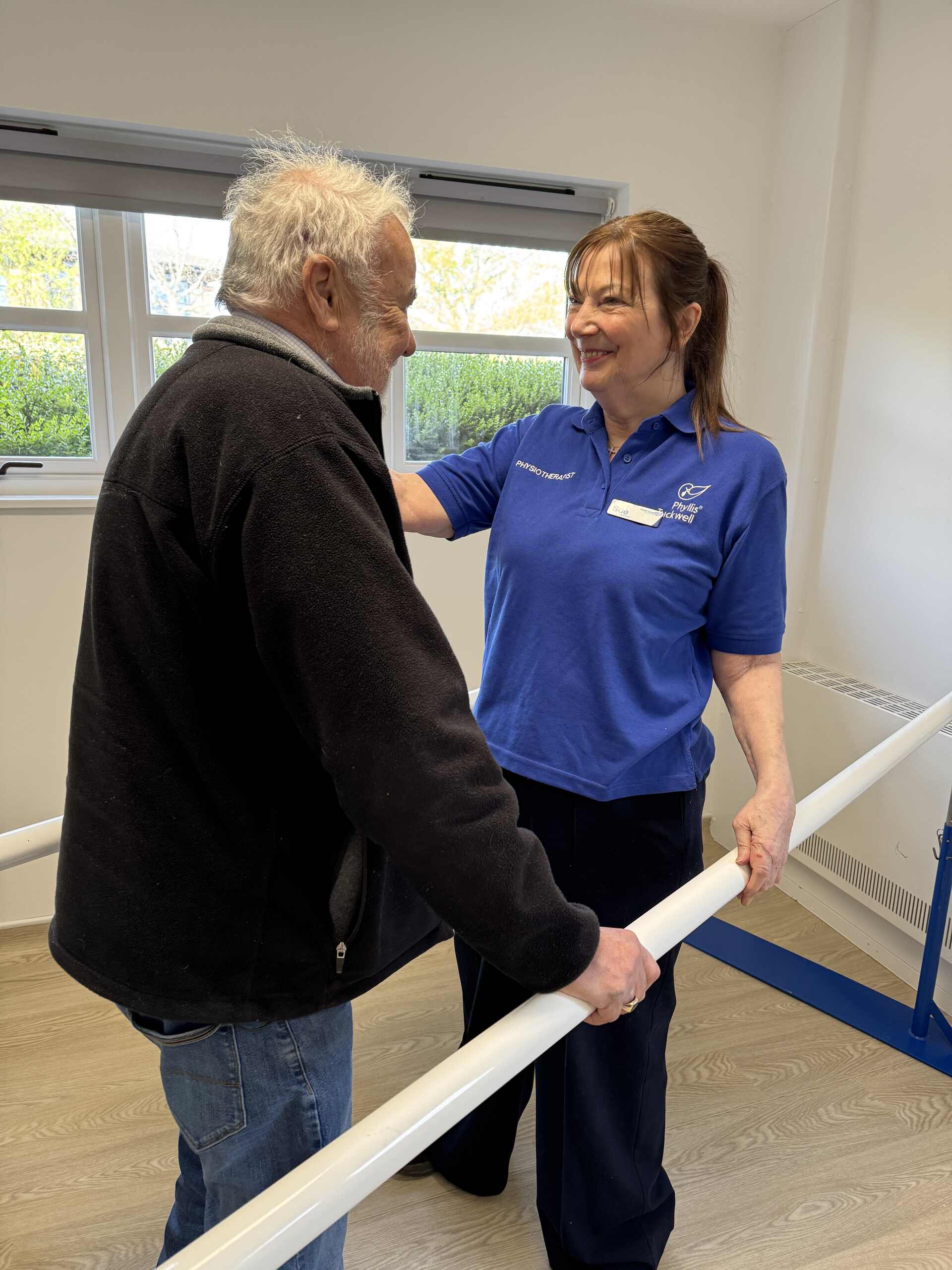 Malcolm with a physiotherapist