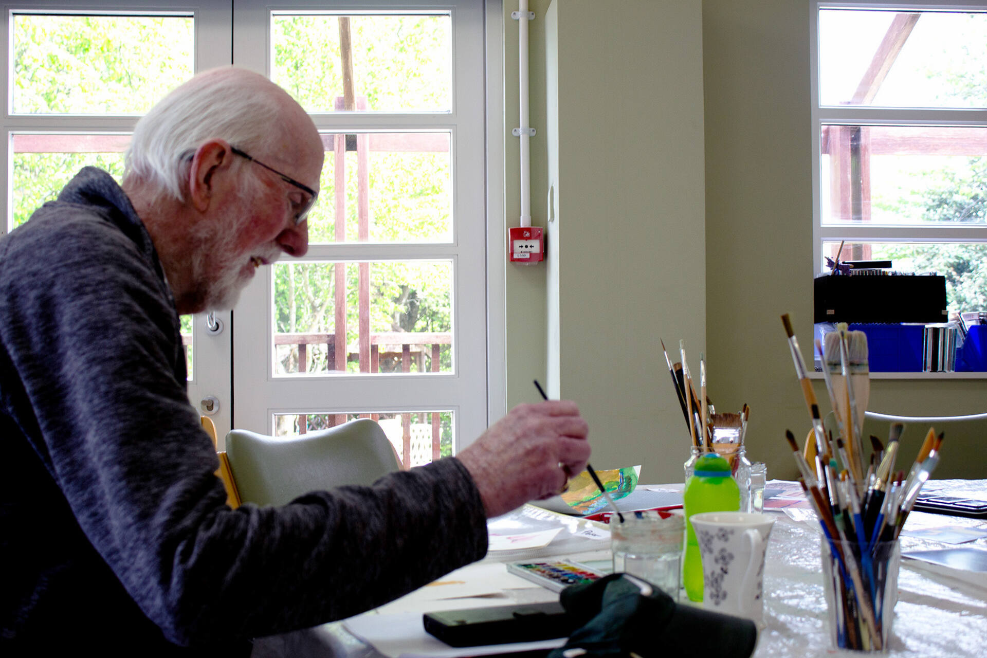 Peter painting at a Living Well session