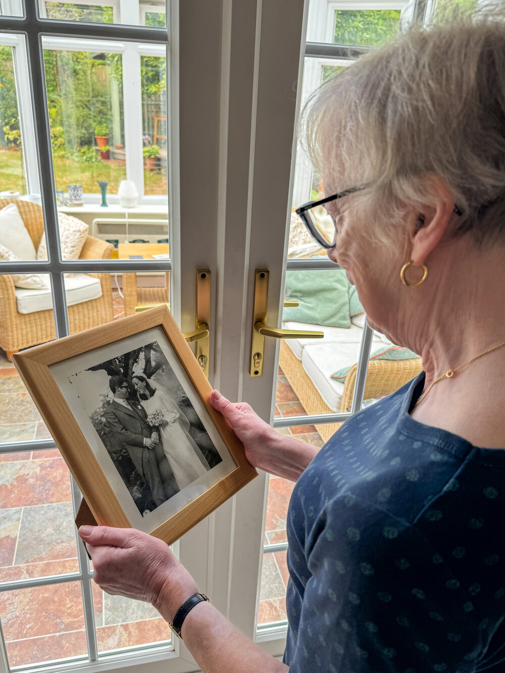 Ruth looking at wedding photo