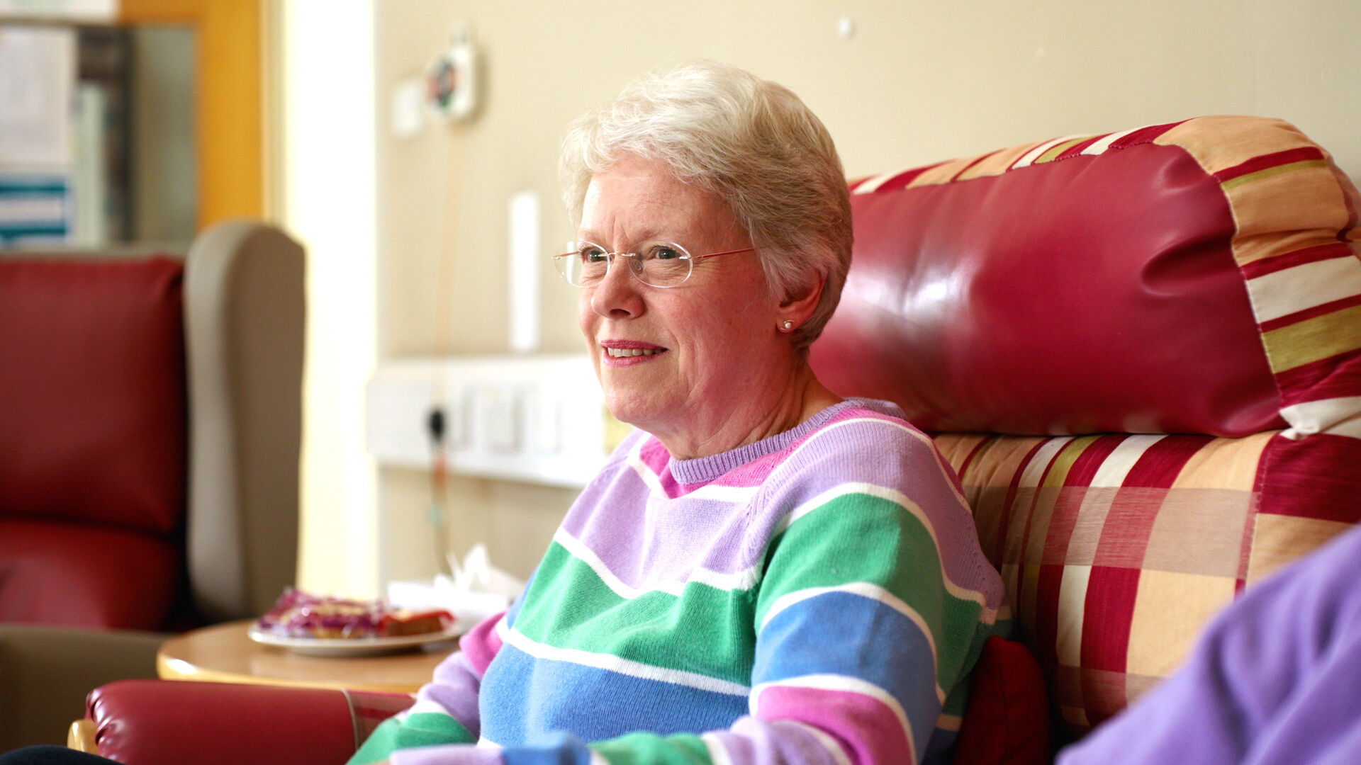 Anne sitting in a chair