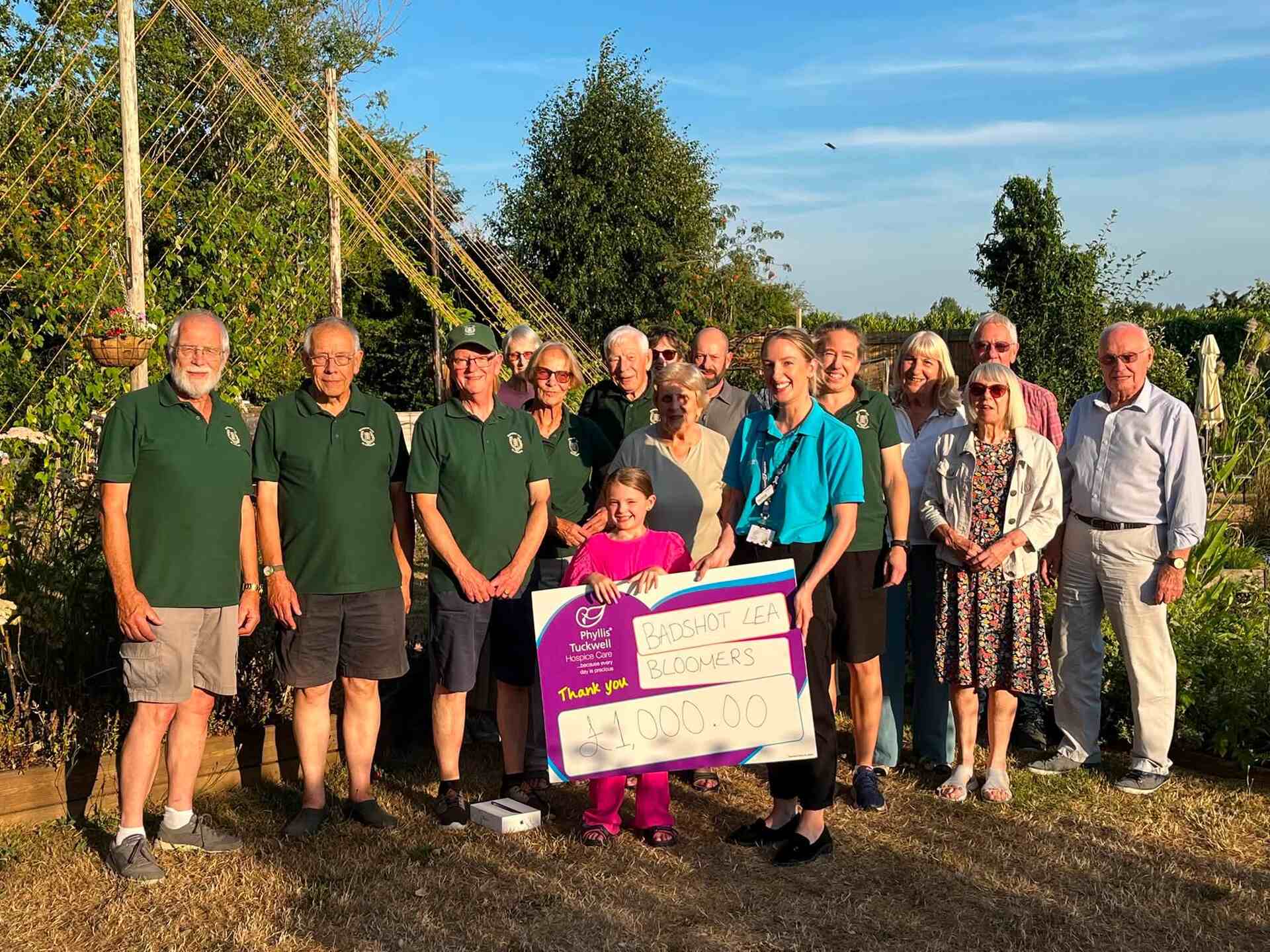 Some people holding a large cheque