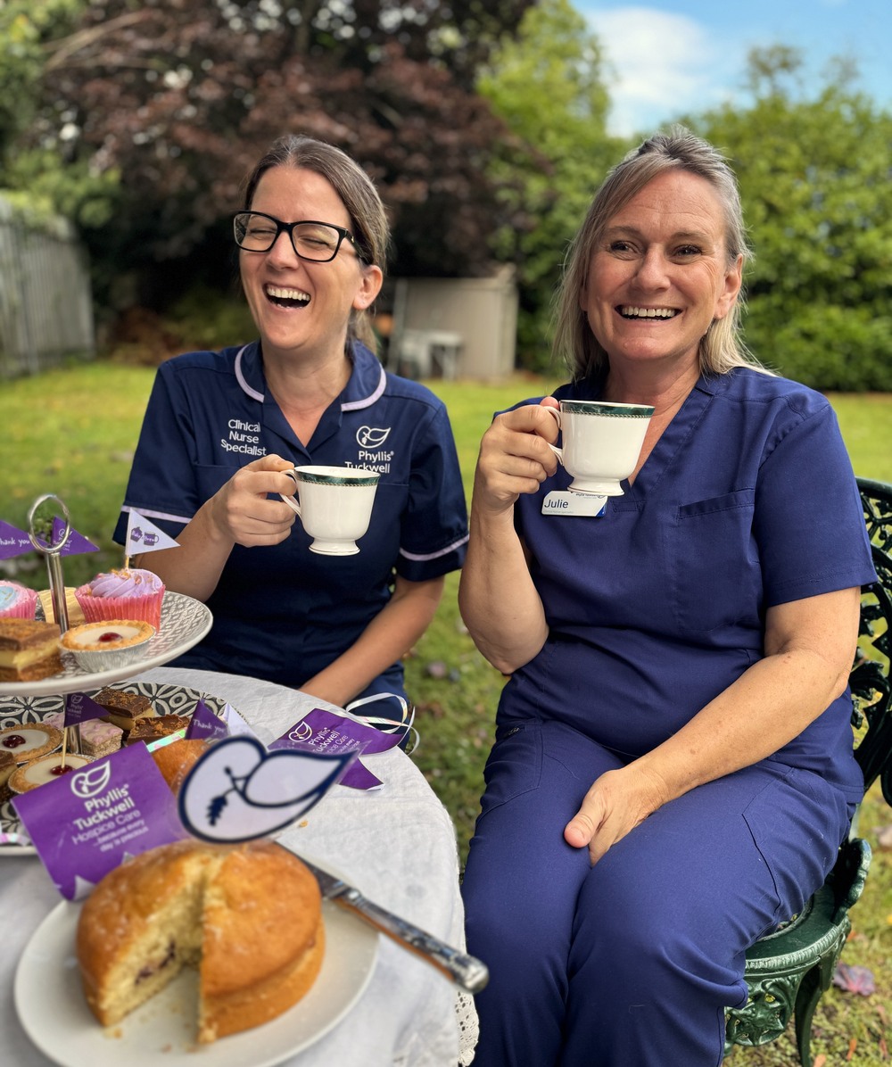Two nurses enjoying tea and cakes