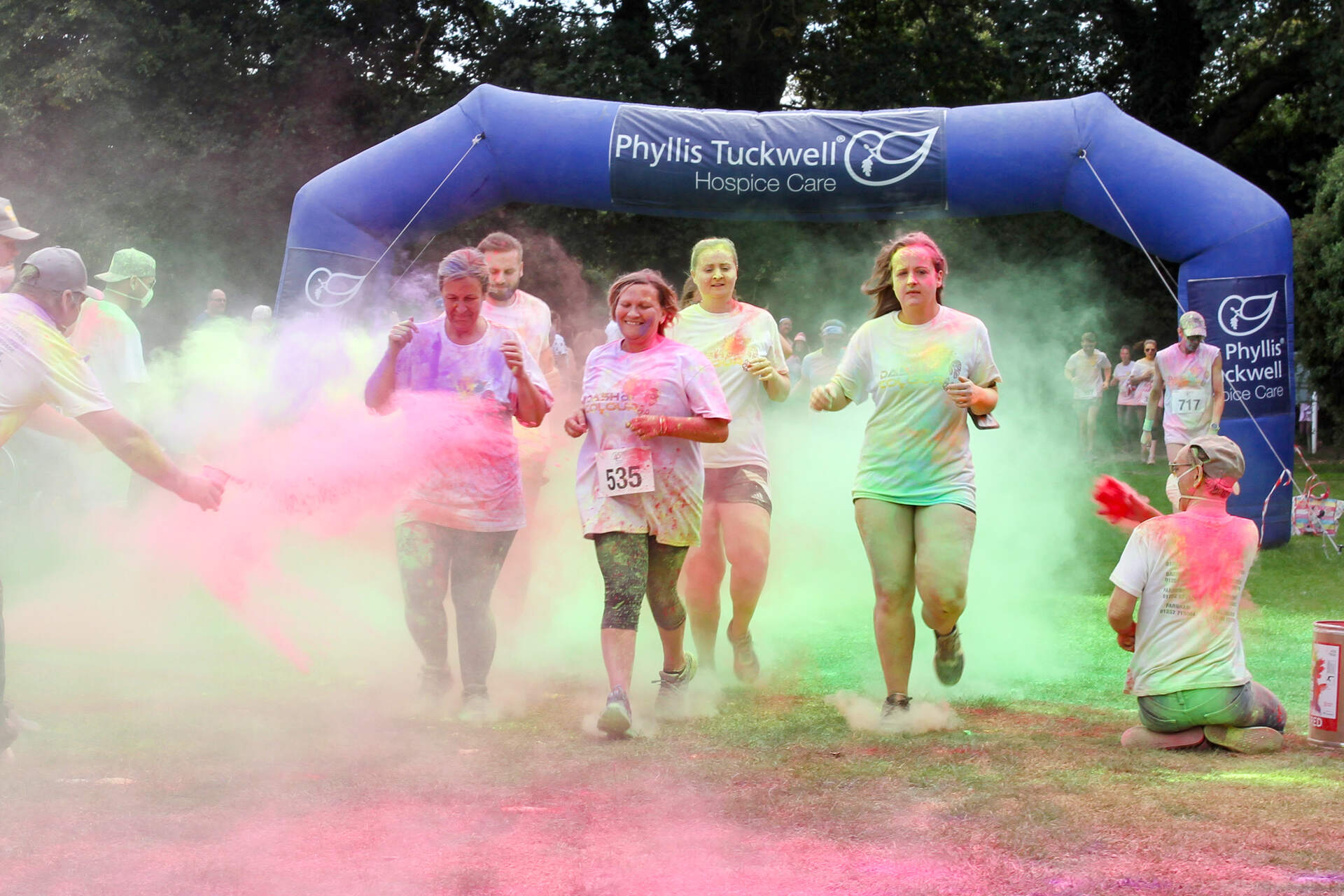 People running in colourful fun run