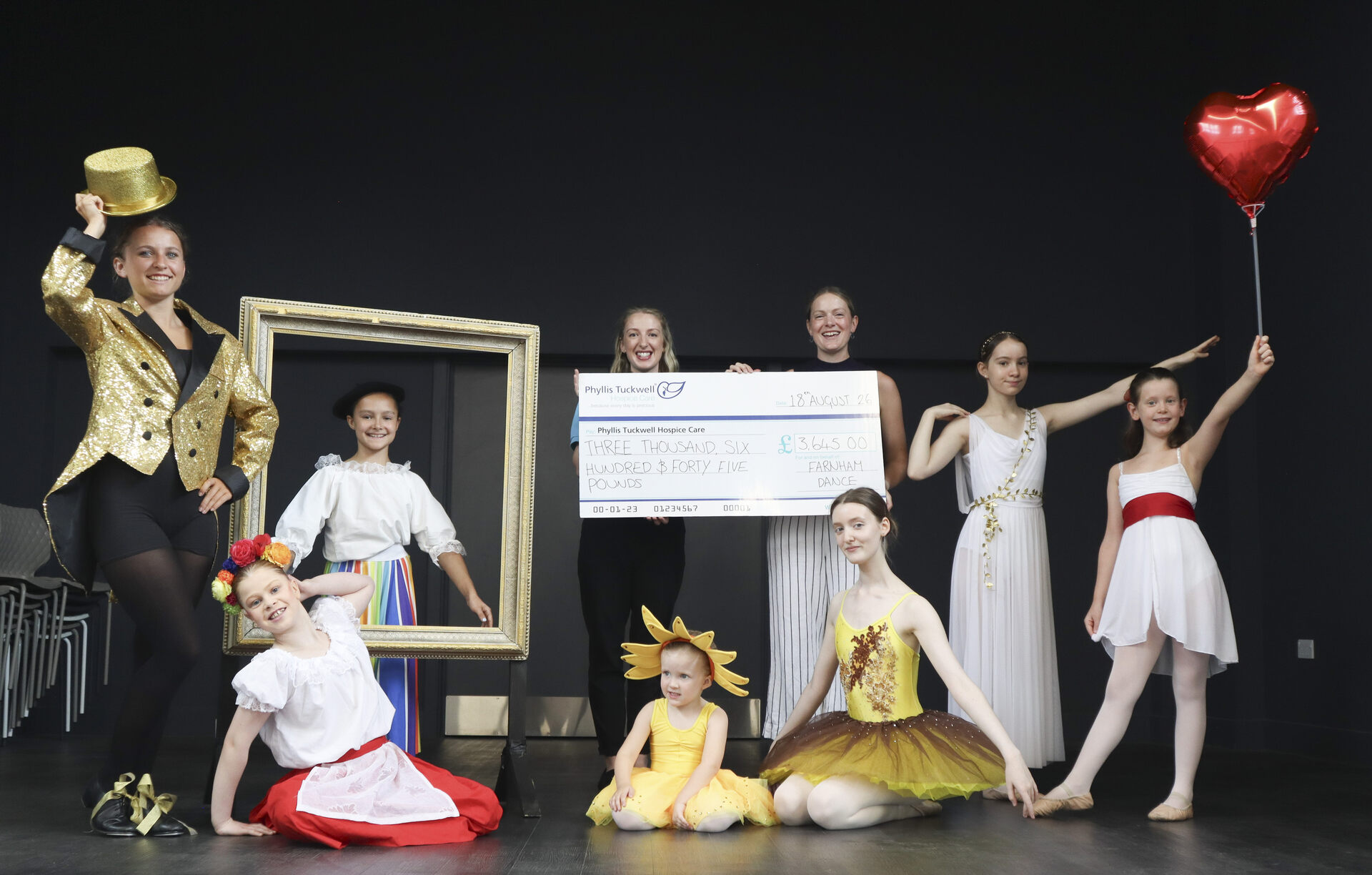 Dancers and a big cheque